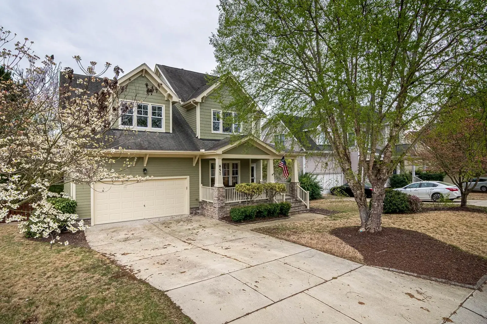 A picturesque suburban home with a lush, the kind of home we buy in Barrett