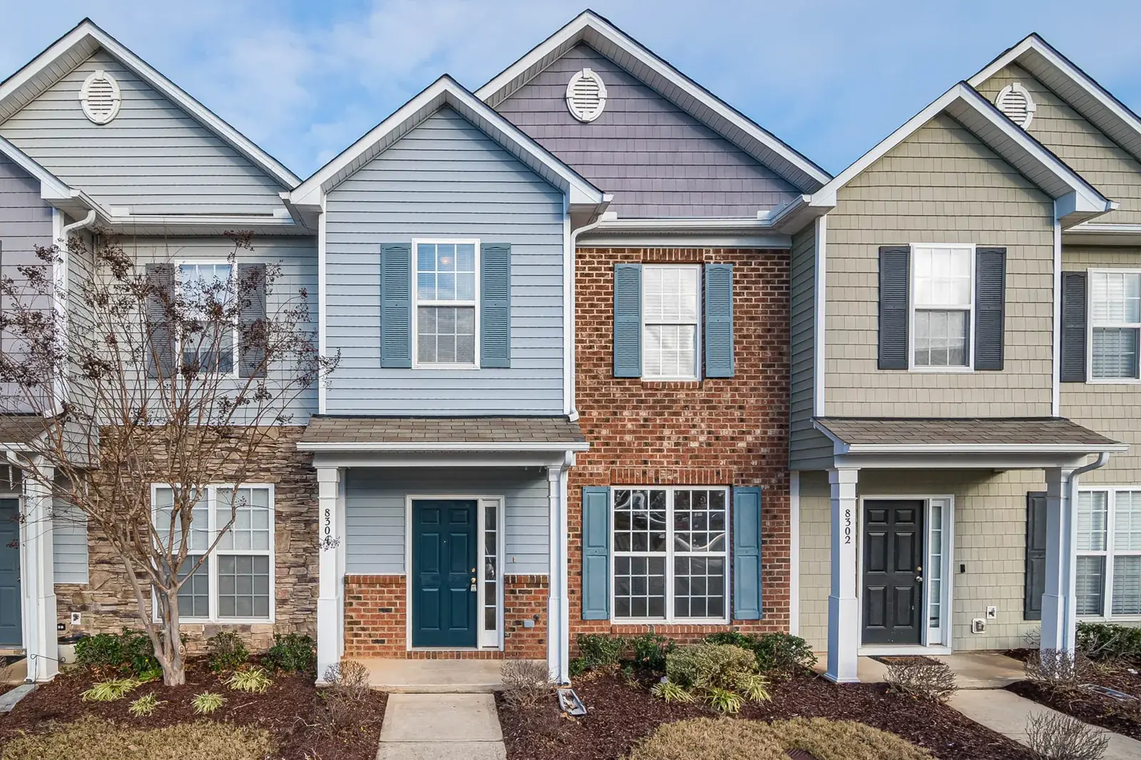 Elegant view of suburban townhouses showcasing, the kind of home we buy in Cinco Ranch