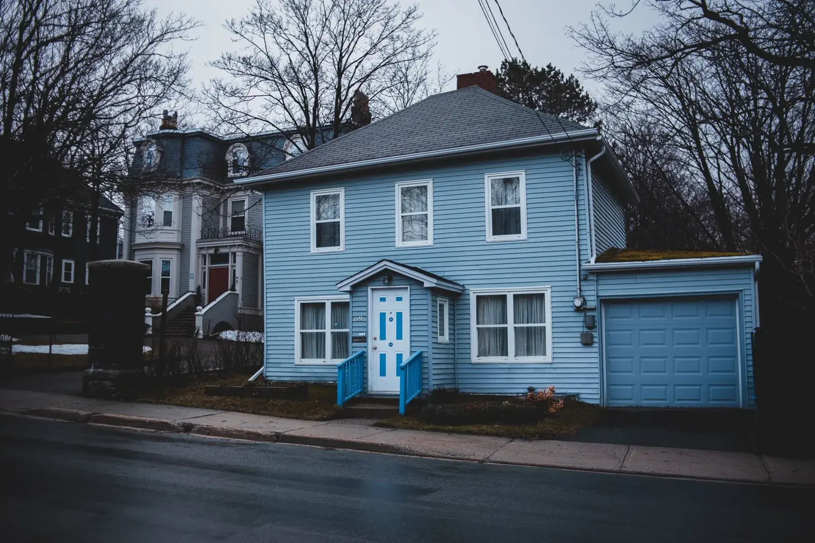 Exterior of small residential house trimmed, the kind of home we buy in Danbury