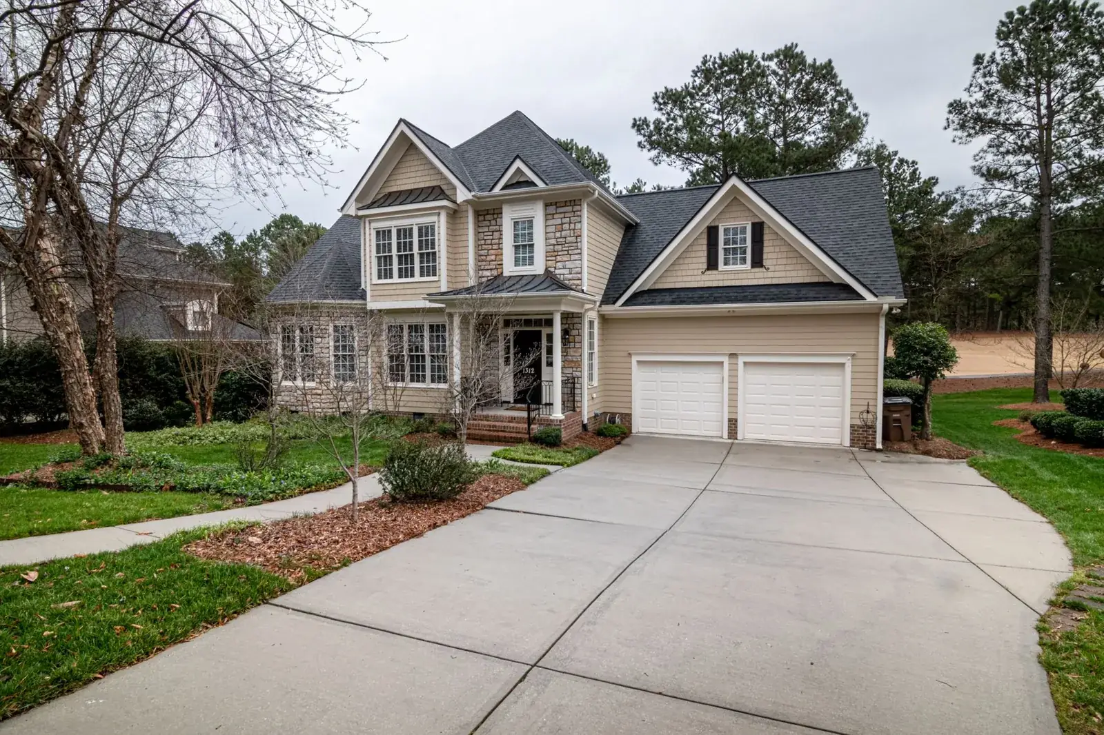 Charming suburban home featuring a two-car garage, the kind of home we buy in Fulshear