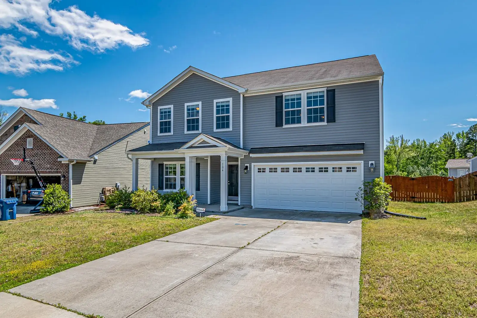 Spacious two-story house with attached garage, the kind of home we buy in Hitchcock