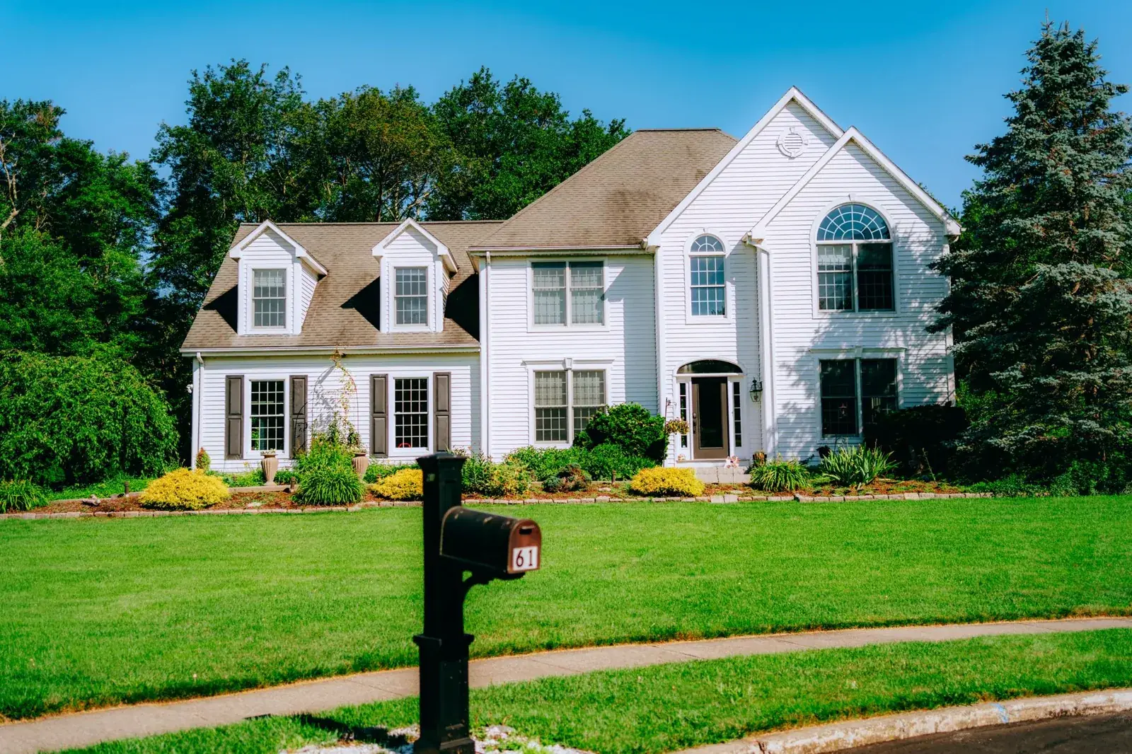 Elegant suburban house exterior, the kind of home we buy in Holiday Lakes