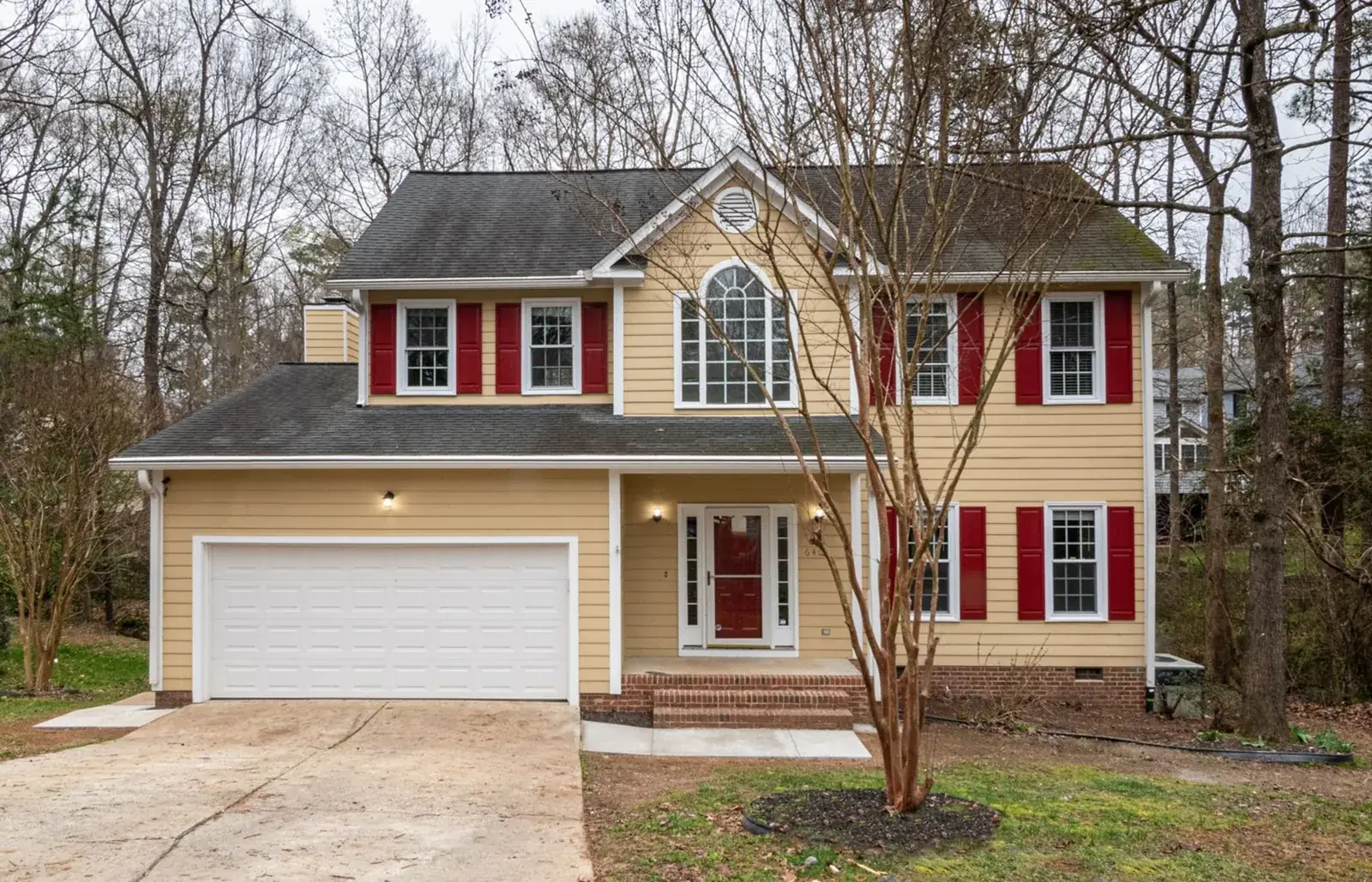 A picturesque suburban home featuring red, the kind of home we buy in Jones Creek