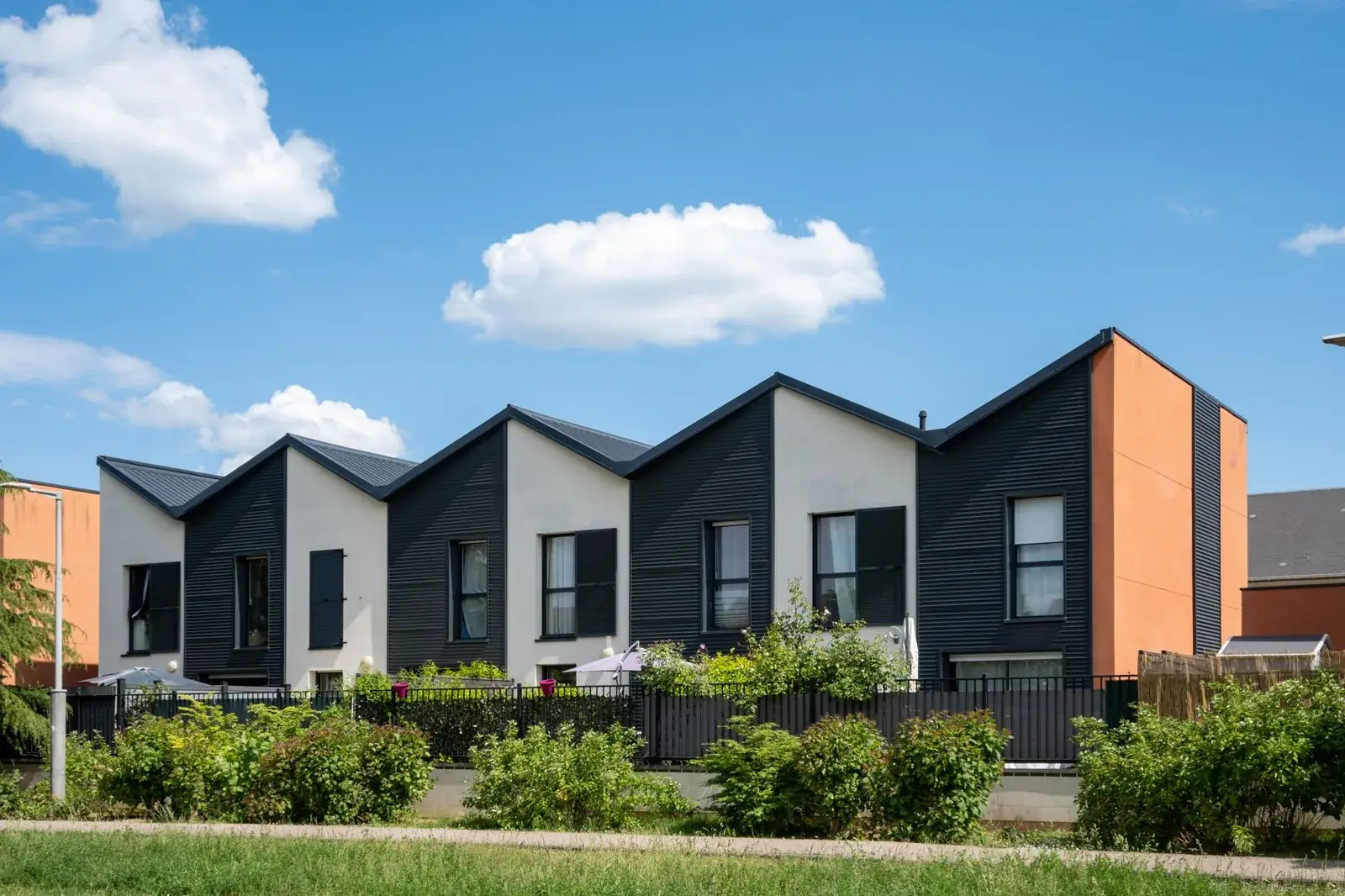 Modern residential houses under a clear, the kind of home we buy in Nassau Bay