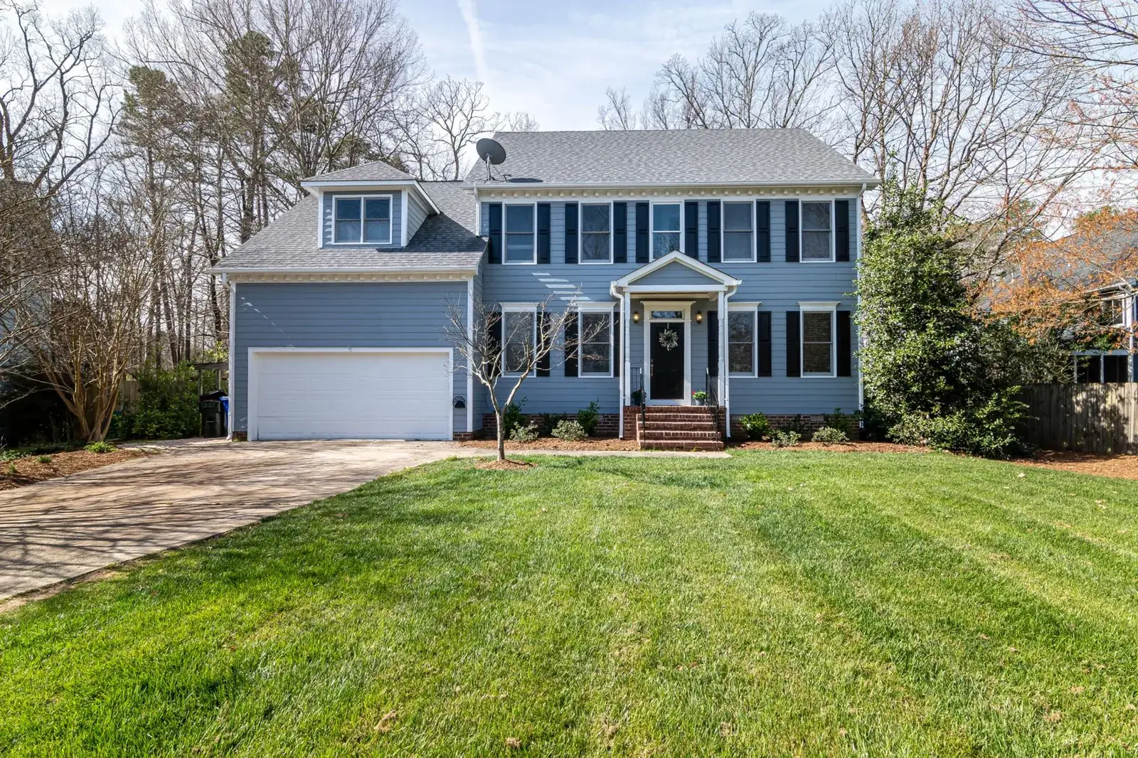 Bright suburban family home with spacious lawn, the kind of home we buy in Needville