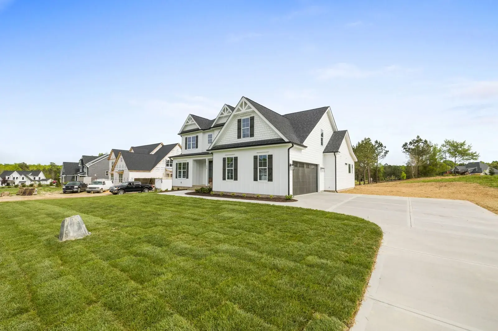 Contemporary suburban house with a large yard, the kind of home we buy in Splendora