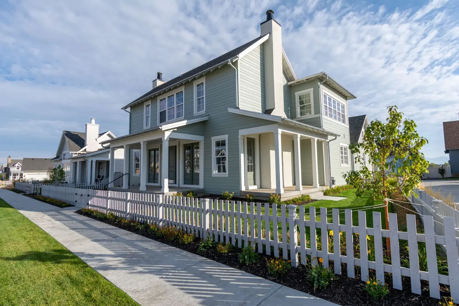 A charming suburban house with a white, the kind of home we buy in Stagecoach