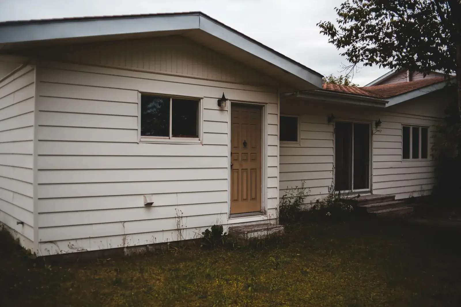 Small poor building exterior, the kind of home we buy in Taylor Lake Village